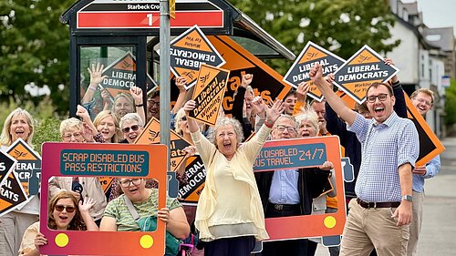 Tom Gordon and bus campaigners celebrate